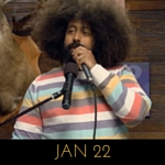 Image of Reggie Watts wearing a pastel striped sweater on Comedy Bang! Bang!