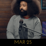 Image of Reggie Watts wearing a cozy time coffin sweater on Comedy Bang! Bang!